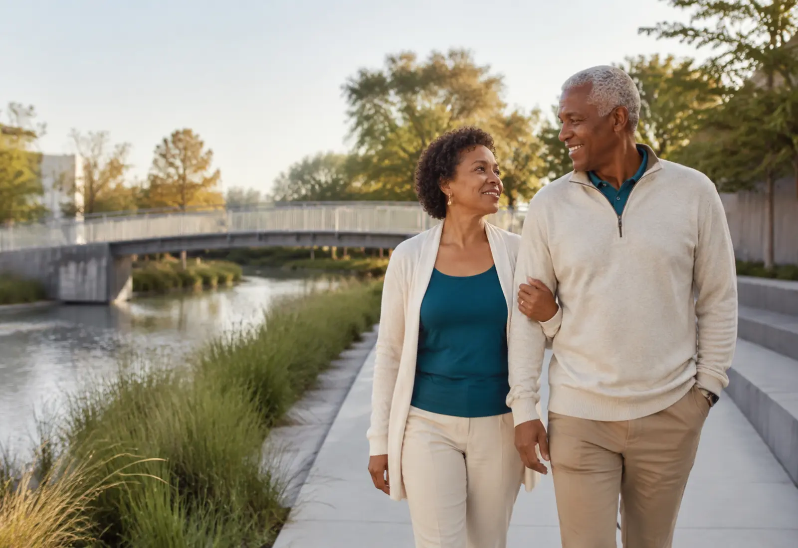 Senior couple walking together near a park bridge
